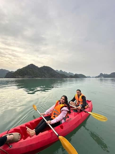 2-Day or 3-Day: Halong&Lan Ha Bay Cruise 5<em> balcony,bathtub – Key things to know before booking’ /></p>
<ul>
<li><strong>A private balcony and bathtub:</strong> Cabins offer more comfort than a basic overnight boat room, with daily mineral water and full facilities.</li>
<li><strong>The three-day trip adds Viet Hai Village:</strong> You visit by bicycle or electric car, with time at a local family home.</li>
<li><strong>Tra Bau is the first major stop:</strong> You can kayak, swim, or use the onboard jacuzzi near the scenery associated with Kong Skull Island.</li>
<li><strong>Dark and Bright Cave offers two ways to visit:</strong> Paddle your own kayak or take a bamboo boat rowed by local boatmen.</li>
<li><strong>The cruise is not nonstop luxury:</strong> The Doria is modern and clean, but meals and evening entertainment may feel ordinary.</li>
<li><strong>Transport needs patience:</strong> The shared limousine bus from Hanoi takes about three hours, and the tender transfer to the cruise can take roughly 45 minutes.</li>
</ul>
<h2>A comfortable boat, with the right expectations</h2>
<p><img width="820" height="614" decoding="async" src=