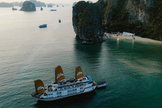 Emeraude Cruise 2 days 1 night Ha Long Bay Tour - Sunset snacks, dinner, and evening time aboard