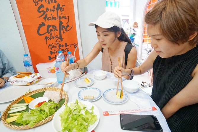 Evening Walking Food Tour, folk game and lantern boat - Banh mi, white rose dumplings, and Hoi An’s signature noodles