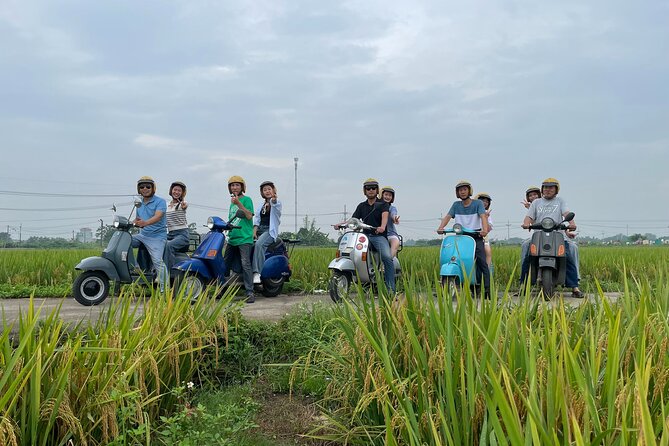 Exploring Vespa Tour Through Little Red River Delta - Long Bien Bridge connects Hanoi with the river plain