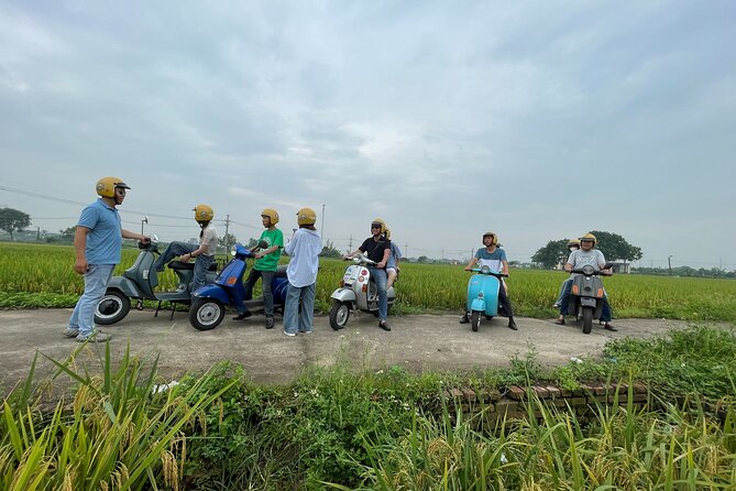 Exploring Vespa Tour Through Little Red River Delta - Hanoi Opera House adds a polished colonial-era contrast