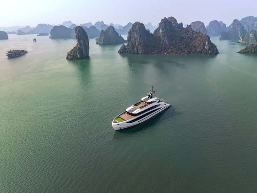 Full Day: Fabulous Halong Bay Tour with Taliya Cruise 5<em> – Key points to know before booking’ /></p>
<ul>
<li><strong>Dark and Bright Cave by bamboo boat:</strong> A local rower takes you through a quiet cave and into a sheltered lagoon.</li>
<li><strong>Ao Ech swimming stop:</strong> You can kayak or swim among limestone mountains in Lan Ha Bay.</li>
<li><strong>Seven-hour cruise:</strong> The boat runs from Tuan Chau Marina through Halong Bay and Lan Ha Bay.</li>
<li><strong>Named guides:</strong> Frank, Vin, and Chung Hoeng Van are among the guides associated with the experience.</li>
<li><strong>Sunset and cooking class:</strong> You make Vietnamese spring rolls, then relax on deck with afternoon tea and sunset views.</li>
<li><strong>Good value at $57:</strong> The price includes lunch, entrance fees, activities, the cruise, and return transport if you select that option.</li>
</ul>
<h2>A long day from Hanoi to Tuan Chau Marina</h2>
<p><img width="820" height="615" decoding="async" src=