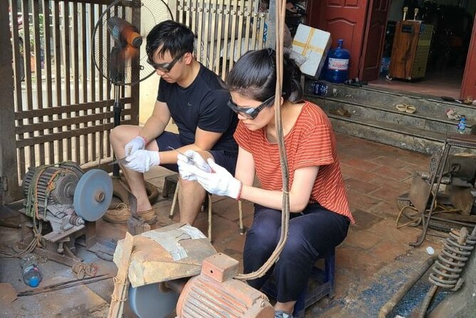 Hanoi Knife Making Traditional Workshop - Shaping the blade beside an expert