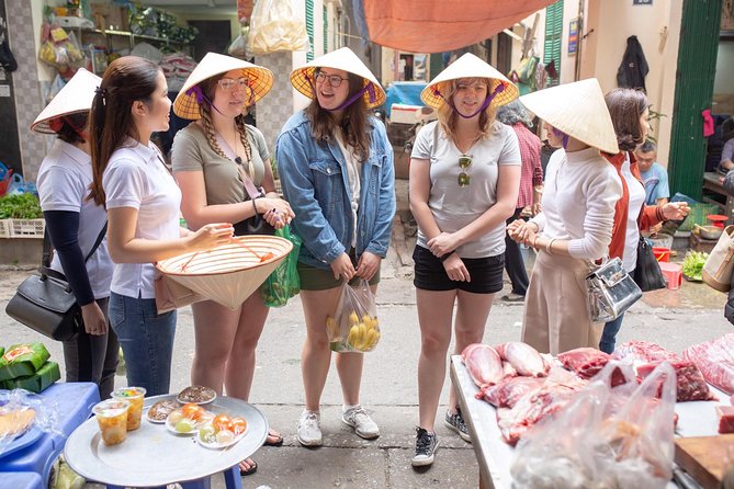 Hanoi Maya Kitchen: Traditional Cooking Class & Market Tour - Rolling spring rolls by hand