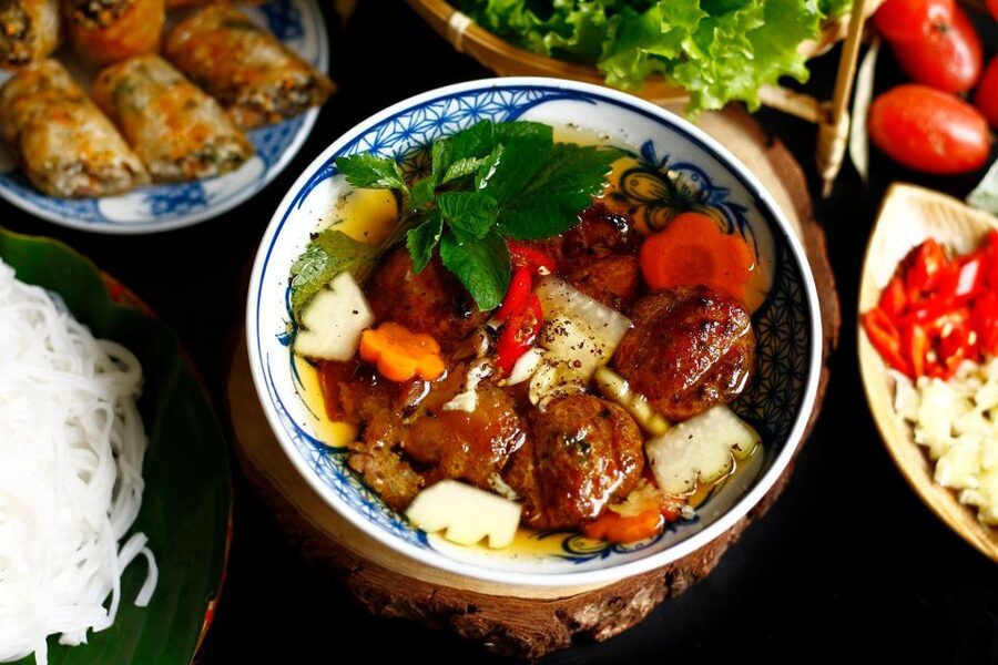Hanoi: Walking Street Food Tour & Train Street w/Local Guide - Quiet lanes, crowded streets, and daily Hanoi