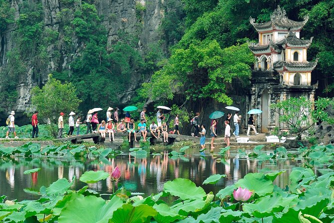 Hoa Lu - Tam Coc - Ninh Binh Day Tour: Biking, Visit Local Family - Cycling through rice fields near Tam Coc