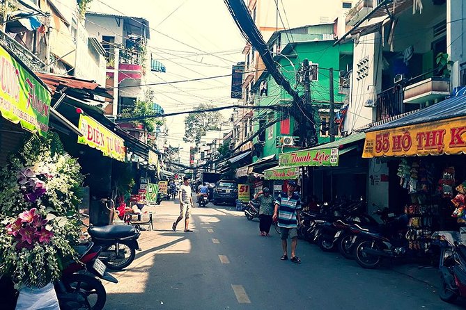 Morning Saigon Unseen+Street Food Tour with Ao Dai Riders Option - District 4 and spring roll vermicelli