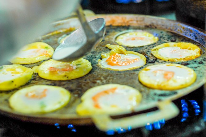 Private Street Food Motorbike Tour in Ho Chi Minh City - District 4: Seafood, barbecue alternatives, and flan